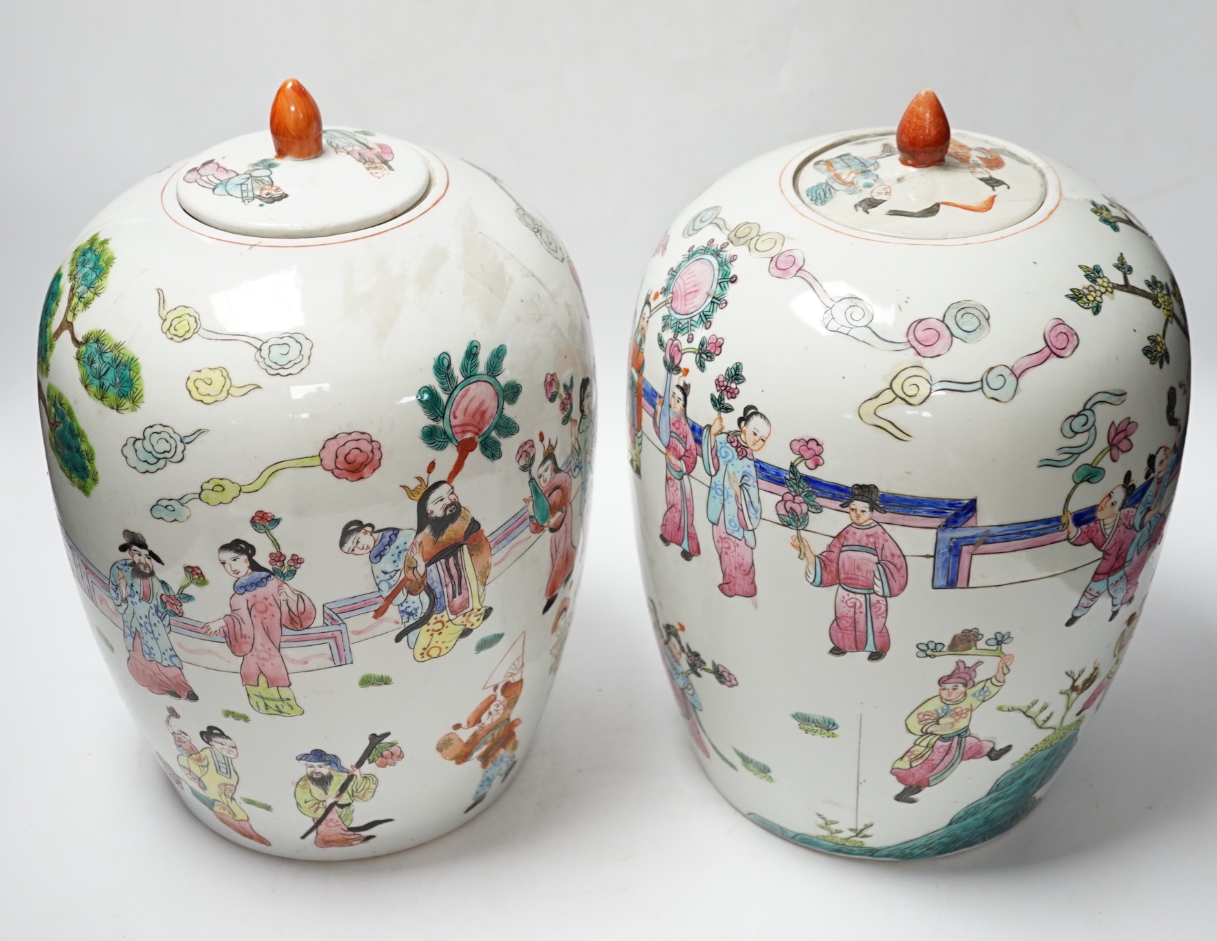 A pair of Chinese famille rose ovoid jar and covers, 32cm high